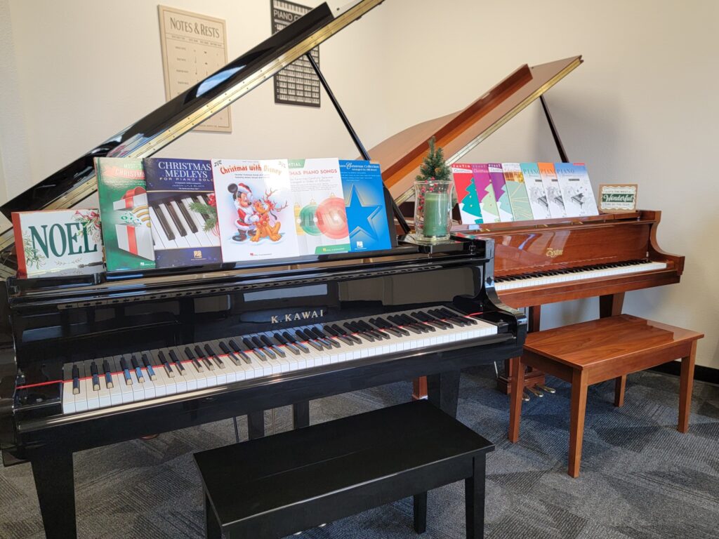 a piano keyboard sitting on top of a wooden table