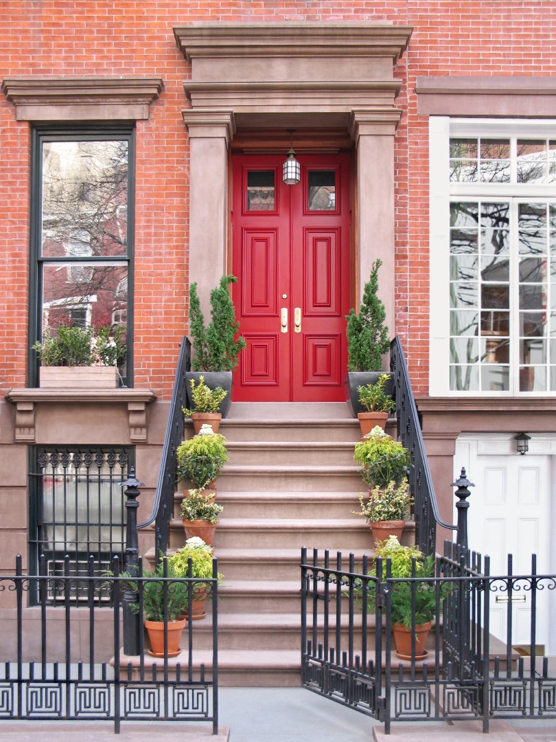 Townhouse Entrance With Ornate Railings And Gate